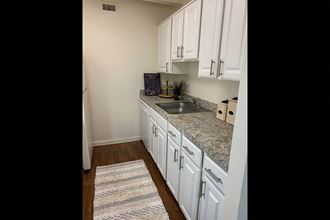 This is a photo of the kitchen in the 965 square foot 1 bedroom, 1 bath  apartment at Harvard Square Apartments, in the Vickery Meadow neighborhood of Dallas, TX.