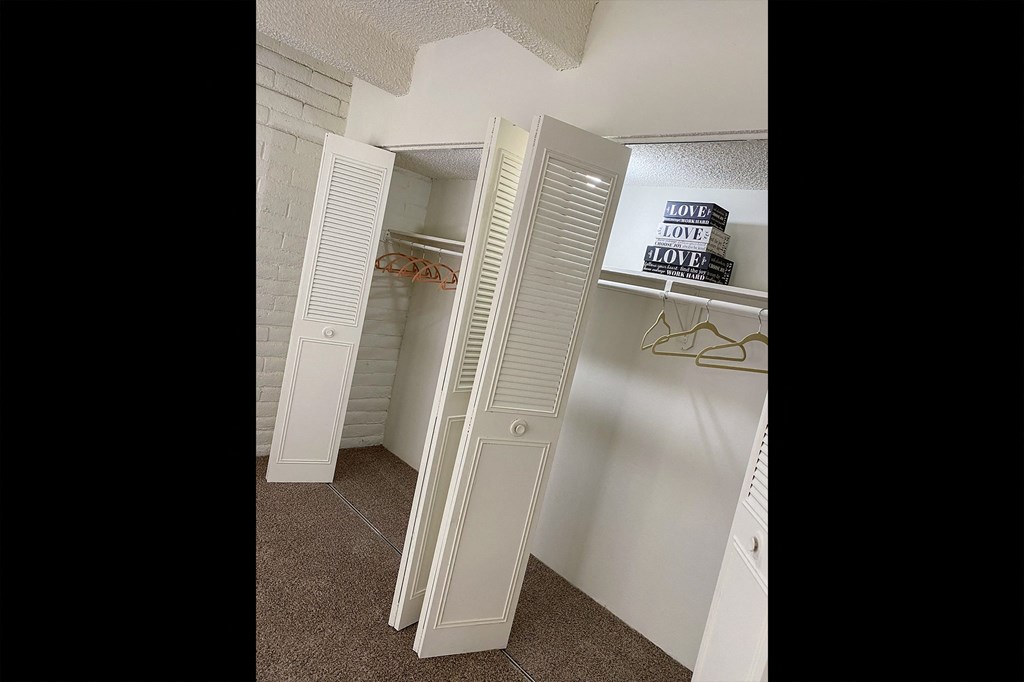 This is a photo of the bedroom closets in the 965 square foot 1 bedroom, 1 bath  apartment at Harvard Square Apartments, in the Vickery Meadow neighborhood of Dallas, TX.