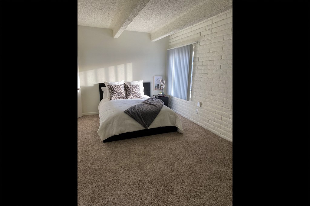 This is a photo of the bedroom in the 965 square foot 1 bedroom, 1 bath  apartment at Harvard Square Apartments, in the Vickery Meadow neighborhood of Dallas, TX.