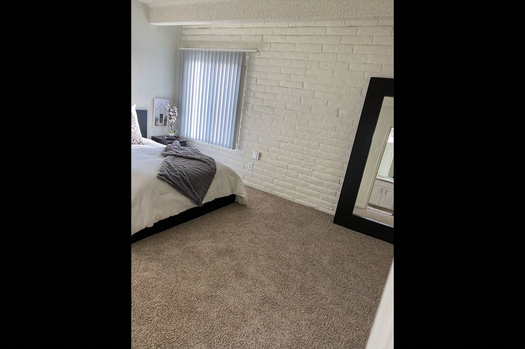This is a photo of the bedroom in the 965 square foot 1 bedroom, 1 bath  apartment at Harvard Square Apartments, in the Vickery Meadow neighborhood of Dallas, TX.