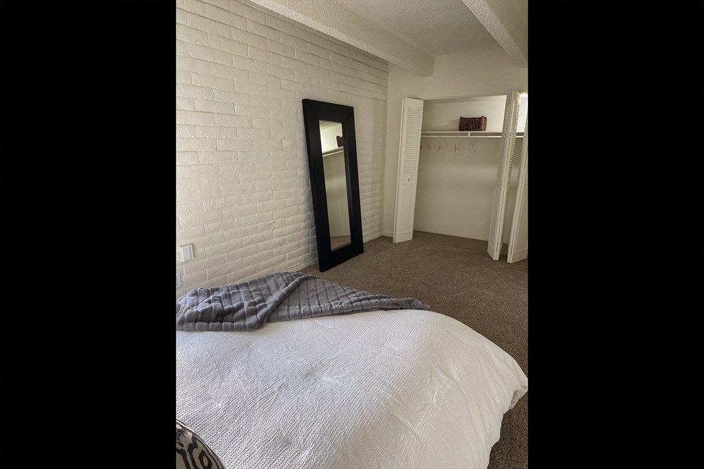 This is a photo of the bedroom in the 965 square foot 1 bedroom, 1 bath  apartment at Harvard Square Apartments, in the Vickery Meadow neighborhood of Dallas, TX.