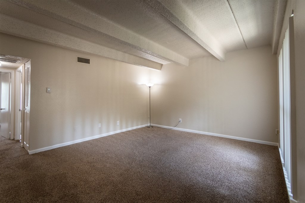 This is a photo of the living room in the 965 square foot 2 bedroom, 2 bath  apartment at Harvard Square Apartments, in Dallas, TX.