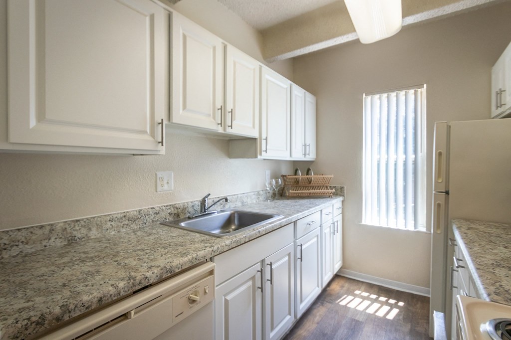 This is a photo of the kitchen in the 965 square foot 2 bedroom, 2 bath  apartment at Harvard Square Apartments, in Dallas, TX.