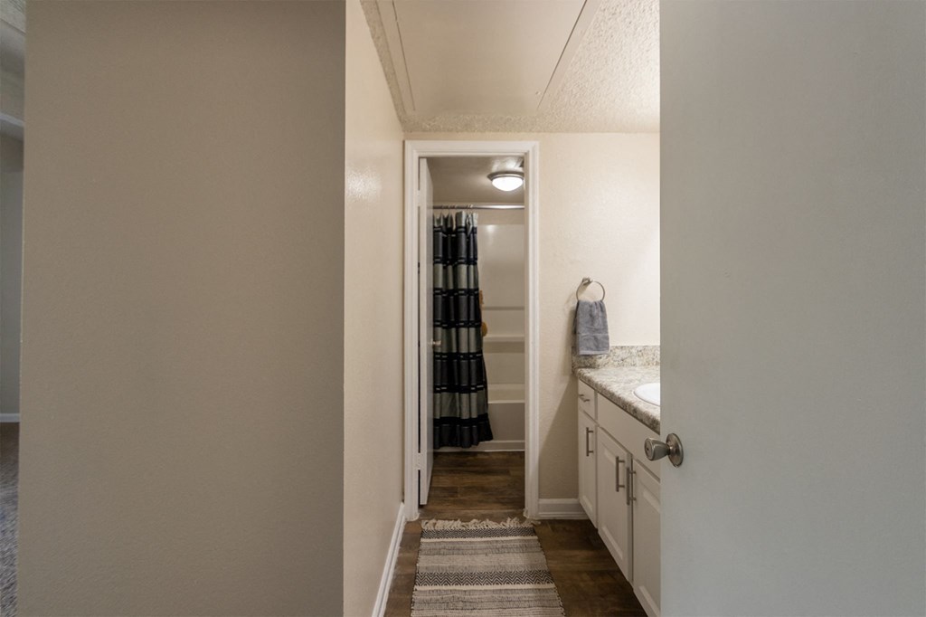 This is a photo of the primary bathroom in the 965 square foot 2 bedroom, 2 bath  apartment at Harvard Square Apartments, in Dallas, TX.
