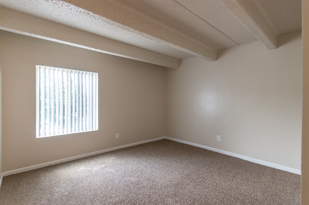 This is a photo of the primary bedroom in the 965 square foot 2 bedroom, 2 bath  apartment at Harvard Square Apartments, in Dallas, TX.