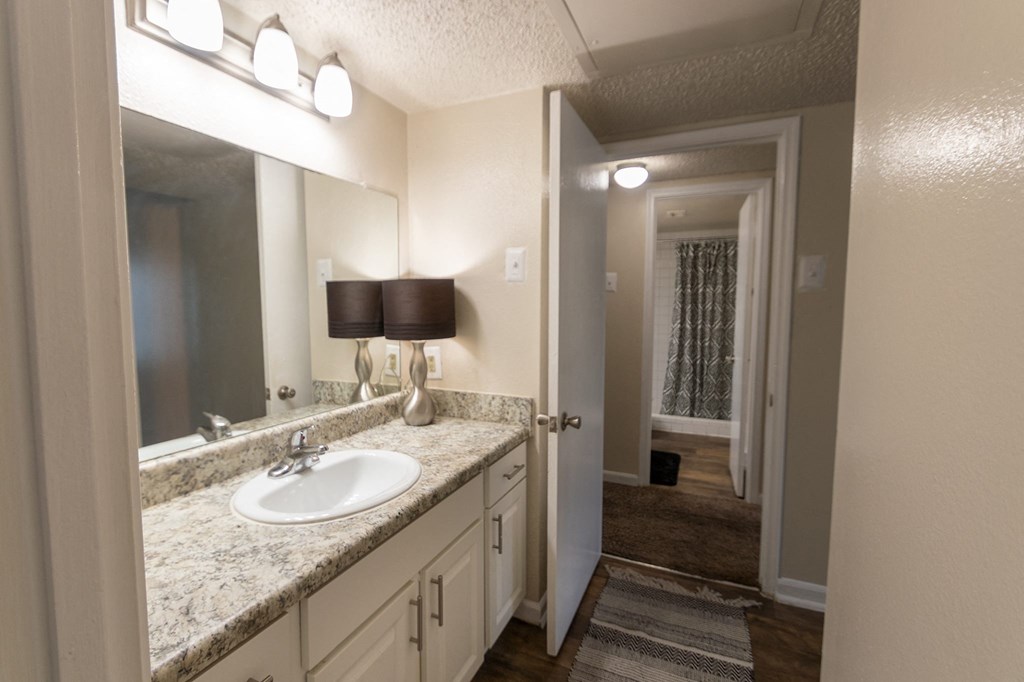 This is a photo of the primary bathroom in the 965 square foot 2 bedroom, 2 bath  apartment at Harvard Square Apartments, in Dallas, TX.