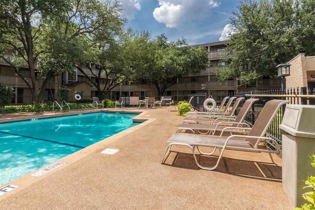 This is a photo of the pool area in the courtyard at Harvard Square Apartments, in the Vickery Meadow neighborhood of Dallas, TX.