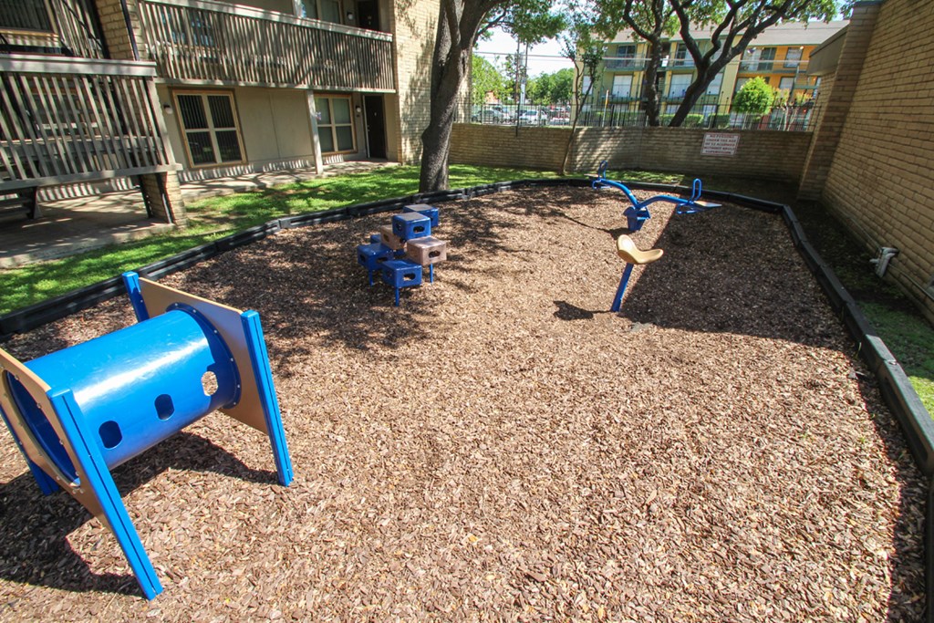 This is a photo of the playground at Harvard Square Apartments in Dallas, TX.