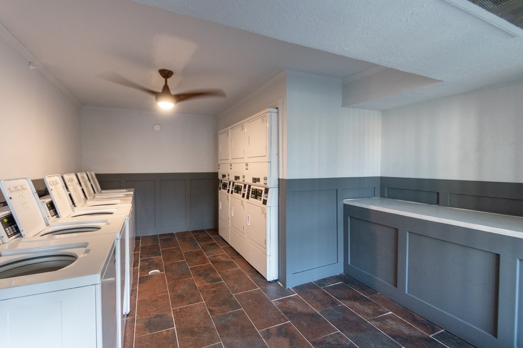 6 washers and dryers and folding area  at Princeton Court, Dallas, TX