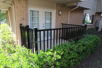 This is a photo of the private patio of the 751 square foot 1 bedroom apartment at Woodbridge Apartments in Dallas, TX.