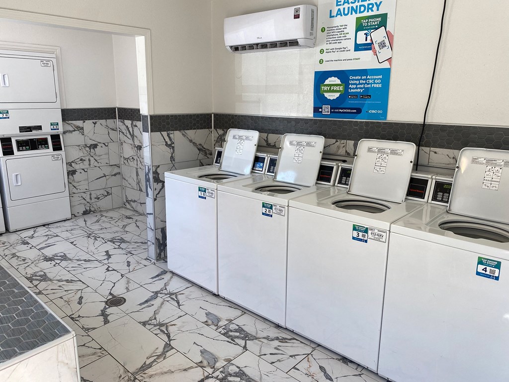 This is a photo of the community clothes center at Woodbridge Apartments in Dallas, Texas.