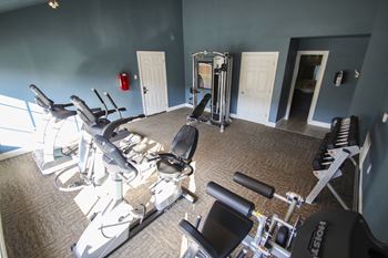 This is a photo of the fitness center with free weights at The Summit at Midtown in Dallas, TX.