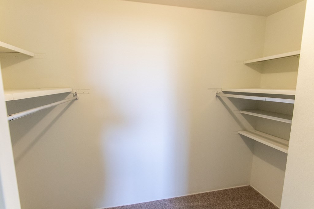 This is a photo of the bedroom walk-in closet in the 545 square foot 1 bedroom, 1 bath apartment at Lisa Ridge Apartments in the Westwood neighborhood of Cincinnati, Ohio.