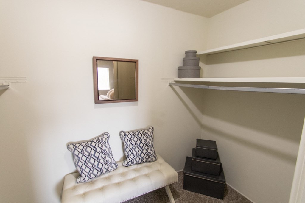 This is a photo of the primary bedroom walk-in closet in the 705 square foot 2 bedroom, 1 bath apartment at Lisa Ridge Apartments in the Westwood neighborhood of Cincinnati, Ohio.