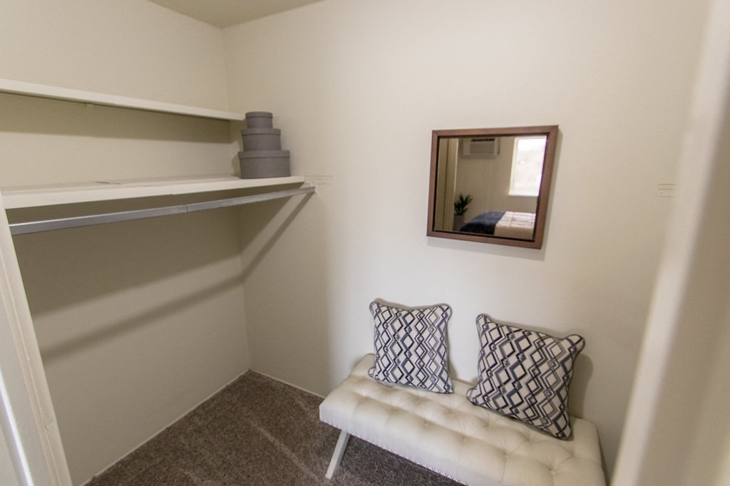 This is a photo of the primary bedroom walk-in closet in the 705 square foot 2 bedroom, 1 bath apartment at Lisa Ridge Apartments in the Westwood neighborhood of Cincinnati, Ohio.