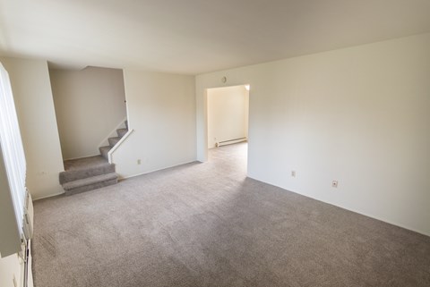 This is a photo of the living room in the 1004 square foot, 2 bedroom, 1.5 bath townhome floor plan at Lake of the Woods Apartments in Cincinnati, OH.