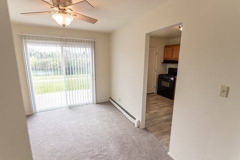 This is a photo of the dining room in the 1004 square foot, 2 bedroom, 1.5 bath townhome floor plan at Lake of the Woods Apartments in Cincinnati, OH.