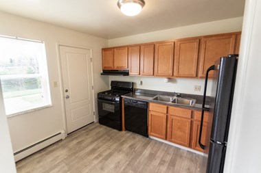 This is a photo of the kitchen in the 1004 square foot, 2 bedroom, 1.5 bath townhome floor plan at Lake of the Woods Apartments in Cincinnati, OH.