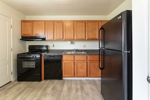 This is a photo of the kitchen in the 1004 square foot, 2 bedroom, 1.5 bath townhome floor plan at Lake of the Woods Apartments in Cincinnati, OH.