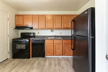 This is a photo of the kitchen in the 1004 square foot, 2 bedroom, 1.5 bath townhome floor plan at Lake of the Woods Apartments in Cincinnati, OH. - Photo Gallery 2
