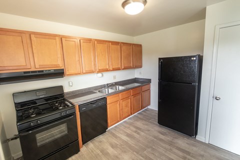 This is a photo of the kitchen in the 1004 square foot, 2 bedroom, 1.5 bath townhome floor plan at Lake of the Woods Apartments in Cincinnati, OH.