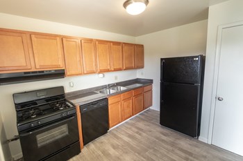 This is a photo of the kitchen in the 1004 square foot, 2 bedroom, 1.5 bath townhome floor plan at Lake of the Woods Apartments in Cincinnati, OH. - Photo Gallery 3