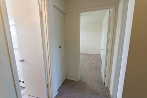 This is a photo of the linen closet in the upstairs hallway in the 1004 square foot, 2 bedroom, 1.5 bath townhome floor plan at Lake of the Woods Apartments in Cincinnati, OH.