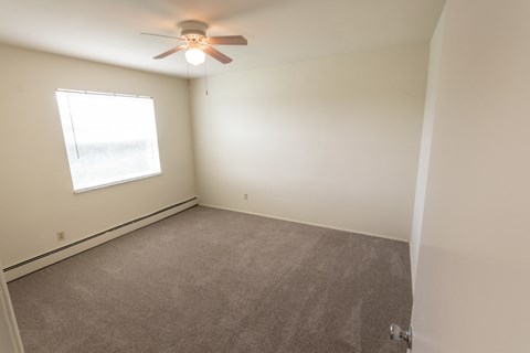 This is a photo of the second bedroom in the 1004 square foot, 2 bedroom, 1.5 bath townhome floor plan at Lake of the Woods Apartments in Cincinnati, OH.