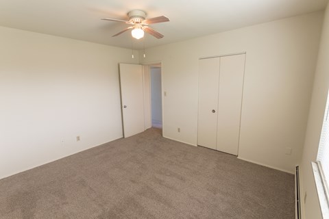 This is a photo of the second bedroom in the 1004 square foot, 2 bedroom, 1.5 bath townhome floor plan at Lake of the Woods Apartments in Cincinnati, OH.