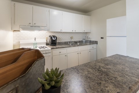 This is a photo of the kitchen of the 1 bedroom, 631 square foot model apartment at Lake of the Woods Apartments in Cincinnati, OH.