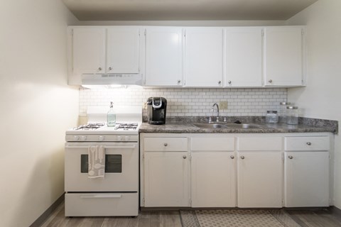 This is a photo of the kitchen of the 1 bedroom, 631 square foot model apartment at Lake of the Woods Apartments in Cincinnati, OH.