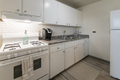 This is a photo of the kitchen of the 1 bedroom, 631 square foot model apartment at Lake of the Woods Apartments in Cincinnati, OH.