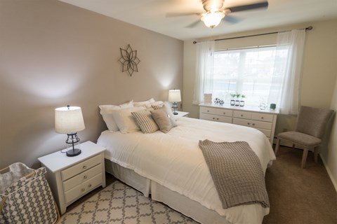 This is a photo of the bedroom of the 1 bedroom, 631 square foot model apartment at Lake of the Woods Apartments in Cincinnati, OH.