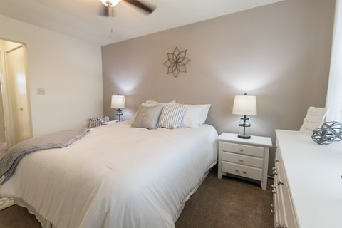 This is a photo of the bedroom of the 1 bedroom, 631 square foot model apartment at Lake of the Woods Apartments in Cincinnati, OH.