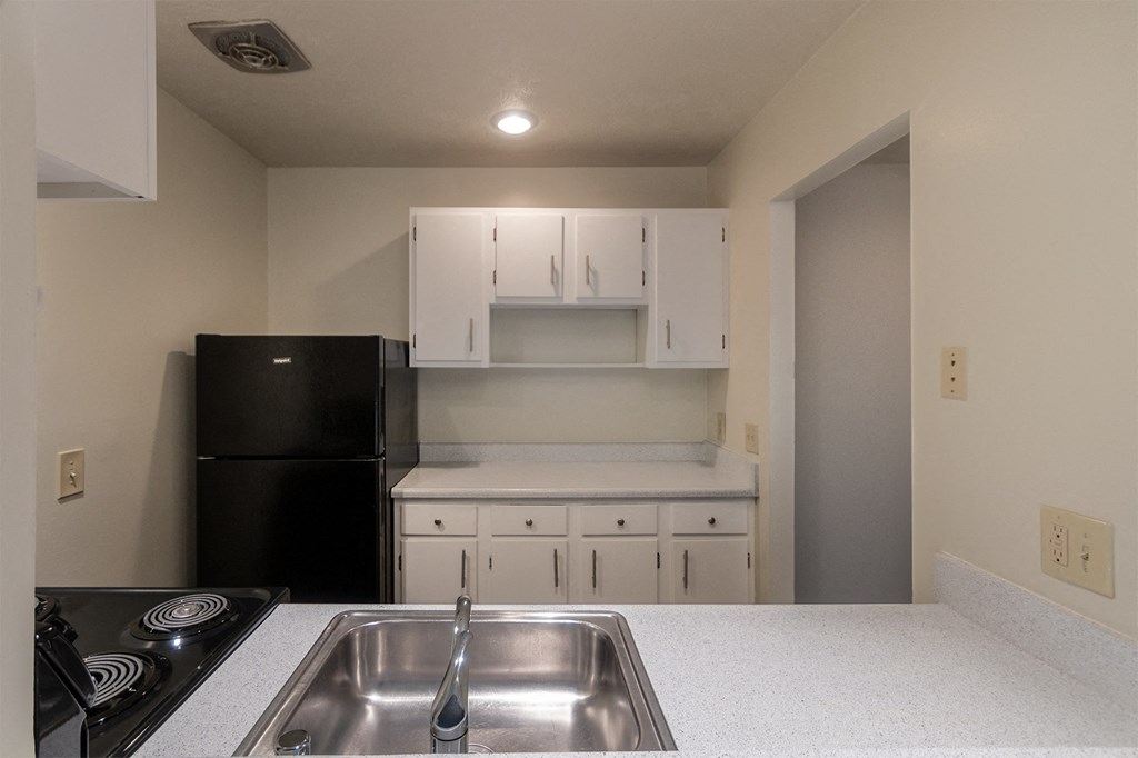 This is a photo the kitchen with white cabinets in the 925 square foot, Hazelnut 2 bedroom, 1 bath apartment at Montana Valley Apartments in the Westwood neighborhood of Cincinnati, OH.