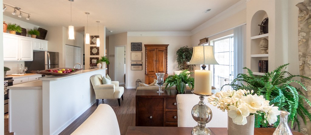 This is a photo of the living room from the dining area in the 2 bedroom, 2 bath Islander floor plan at Nantucket Apartments in Loveland, OH.