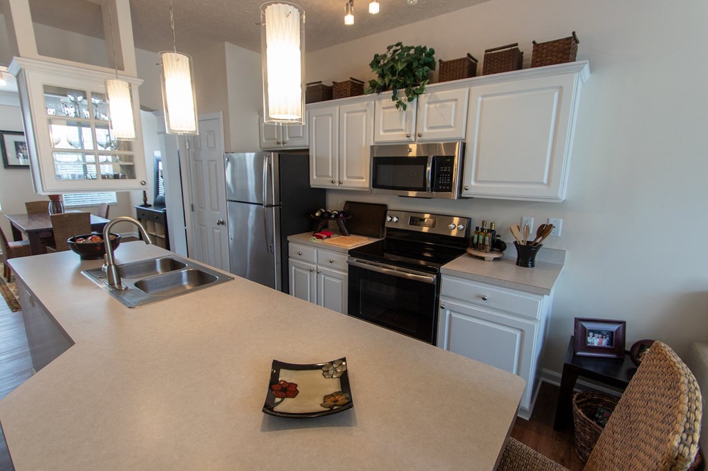 This is a photo of the kitchen in the 1242 square foot, 2 bedroom, 2 and 1/2 bath Spinnaker floor plan at Nantucket Apartments in Loveland, OH.