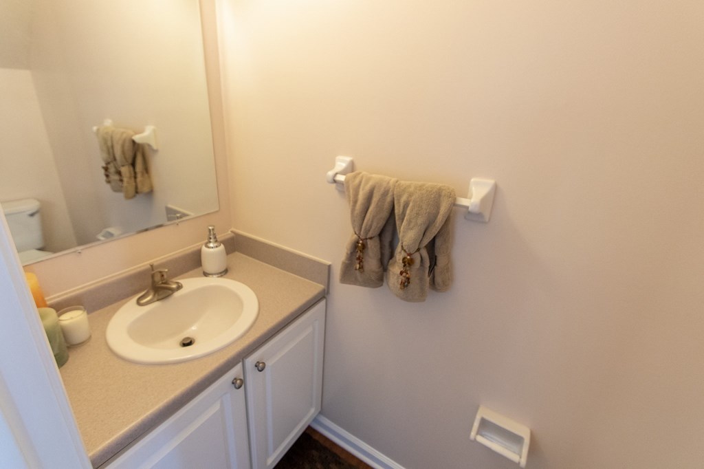 This is a photo of the half bath in the 1242 square foot, 2 bedroom, 2 and 1/2 bath Spinnaker floor plan at Nantucket Apartments in Loveland, OH.