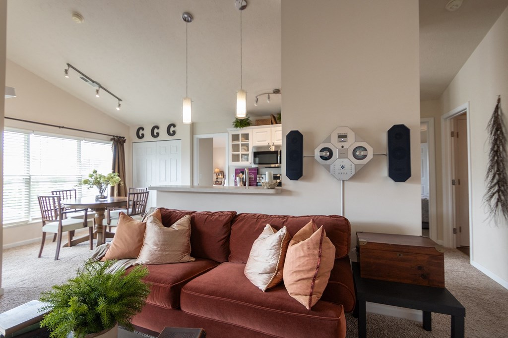 This is a photo of the kitchen and dining area from the living room in the 1016 square foot, 2 bedroom, 2 bath Nautica floor plan at Nantucket Apartments in Loveland, OH.