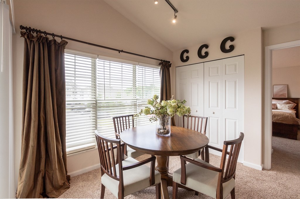 This is a photo of the dining area in the 1016 square foot, 2 bedroom, 2 bath Nautica floor plan at Nantucket Apartments in Loveland, OH.