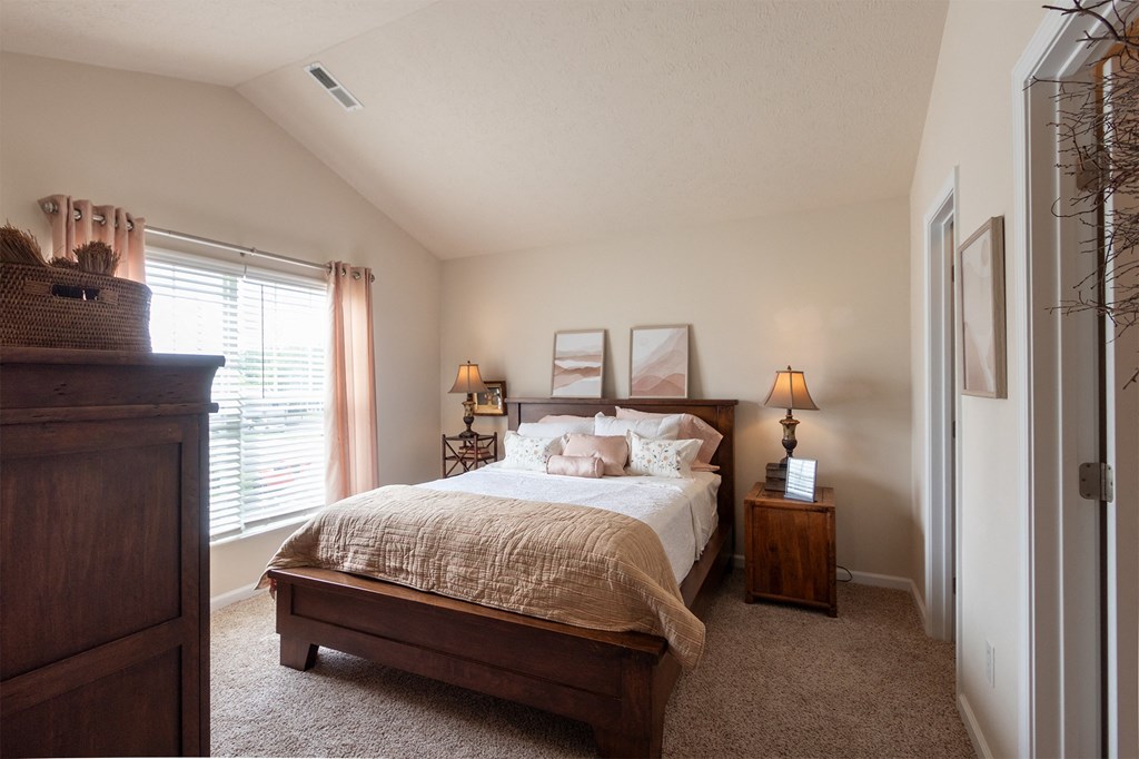 This is a photo of the primary bedroom in the 1016 square foot, 2 bedroom, 2 bath Nautica floor plan at Nantucket Apartments in Loveland, OH.
