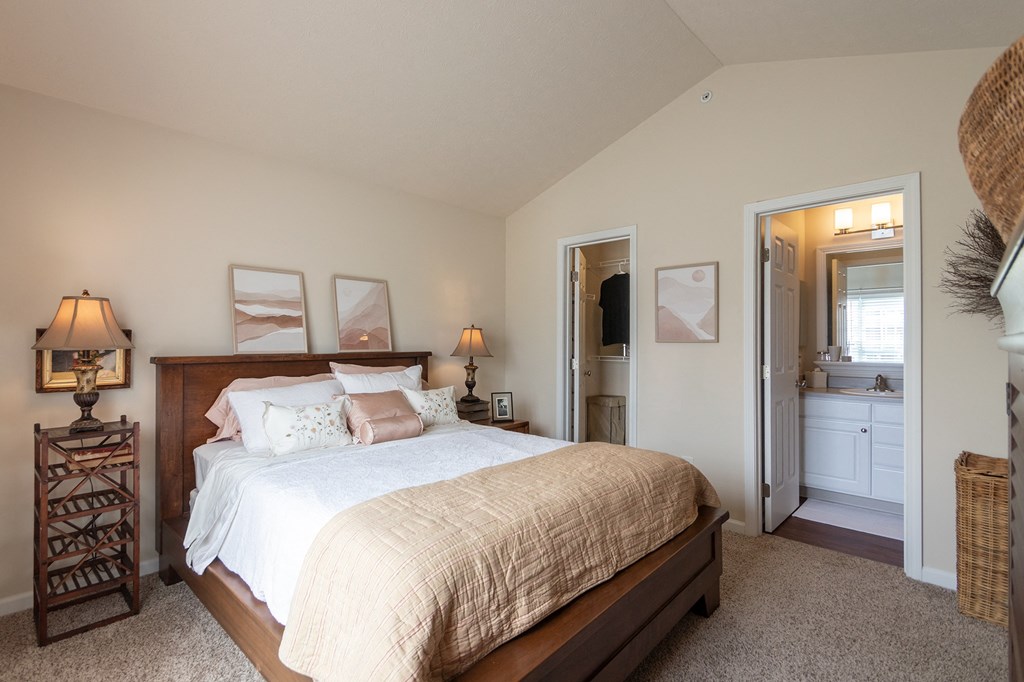 This is a photo of the primary bedroom in the 1016 square foot, 2 bedroom, 2 bath Nautica floor plan at Nantucket Apartments in Loveland, OH.