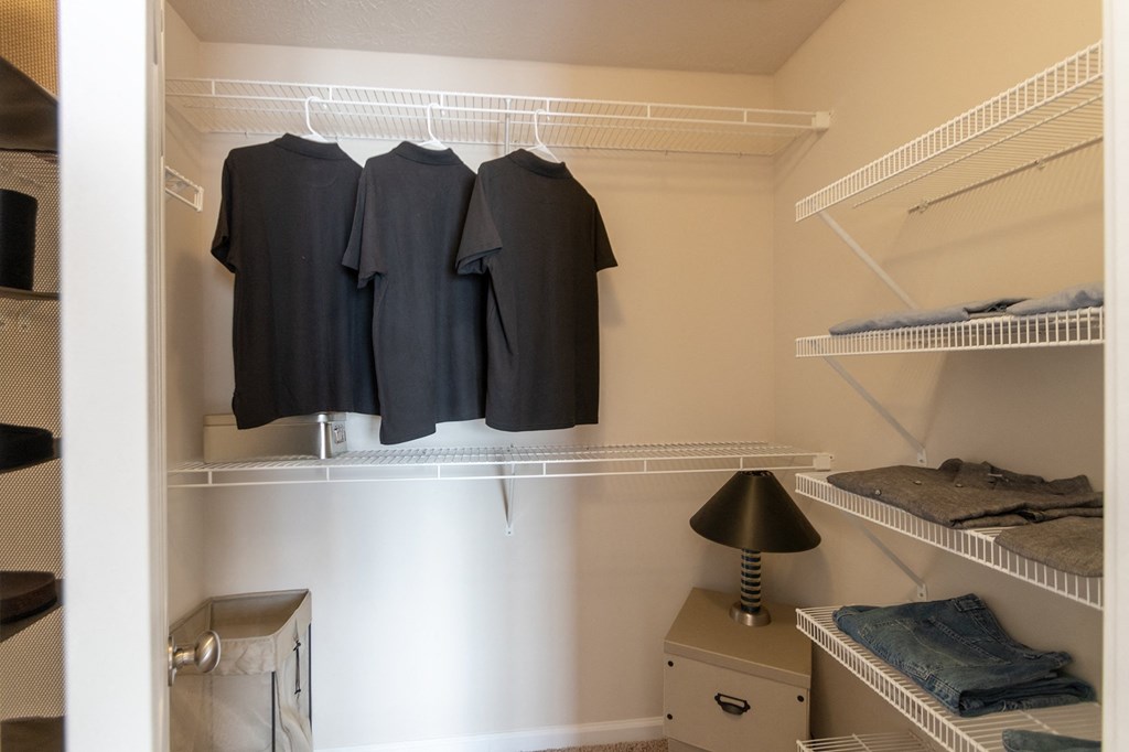 This is a photo of the primary bedroom walk-in closet in the 1016 square foot, 2 bedroom, 2 bath Nautica floor plan at Nantucket Apartments in Loveland, OH.