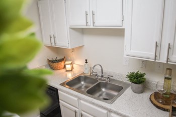 This is a photo of the kitchen in the 653 square foot 1 bedroom apartment at Princeton Court Apartments in Dallas, TX. - Photo Gallery 2