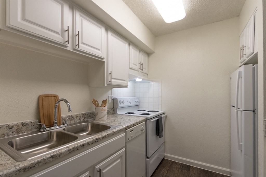 Kitchen With White Cabinets at Princeton Court, Texas