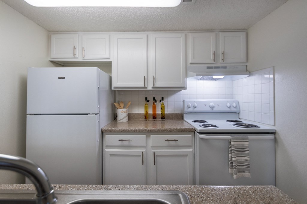 kitchen and hallway from the dining room  at Princeton Court, Dallas, TX