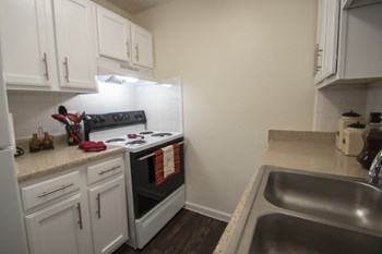 This is a photo of the kitchen in the 653 square foot 1 bedroom apartment at Princeton Court Apartments in Dallas, TX. - Photo Gallery 4