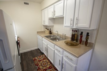 This is a photo of the kitchen in the 653 square foot 1 bedroom apartment at Princeton Court Apartments in Dallas, TX. - Photo Gallery 3