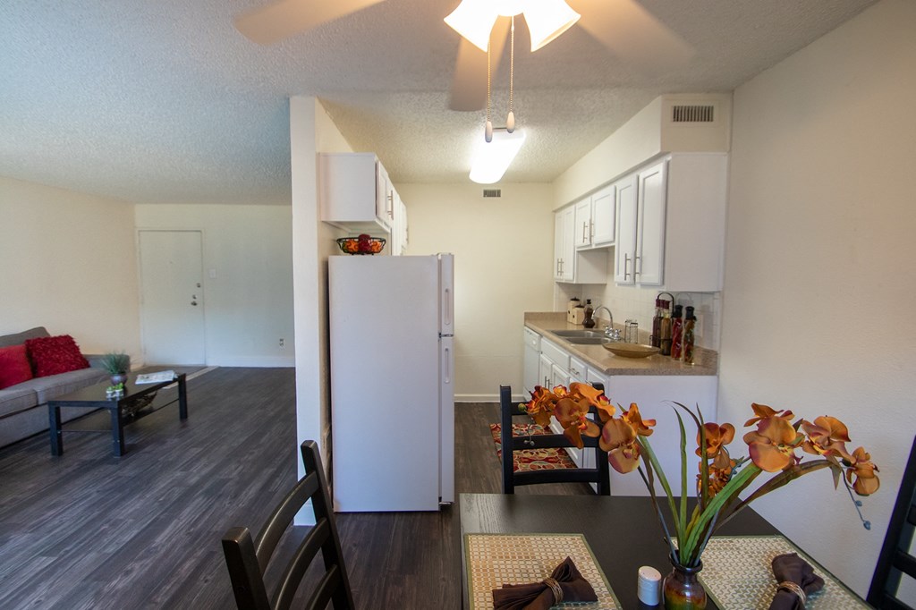 a view of the living room and kitchen of an apartment