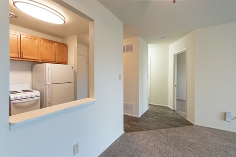 This is a photo of a large kitchen pass through and the hallway in a 560 square foot 1, 1 bath apartment at Park Lane Apartments in Cincinnati, OH.